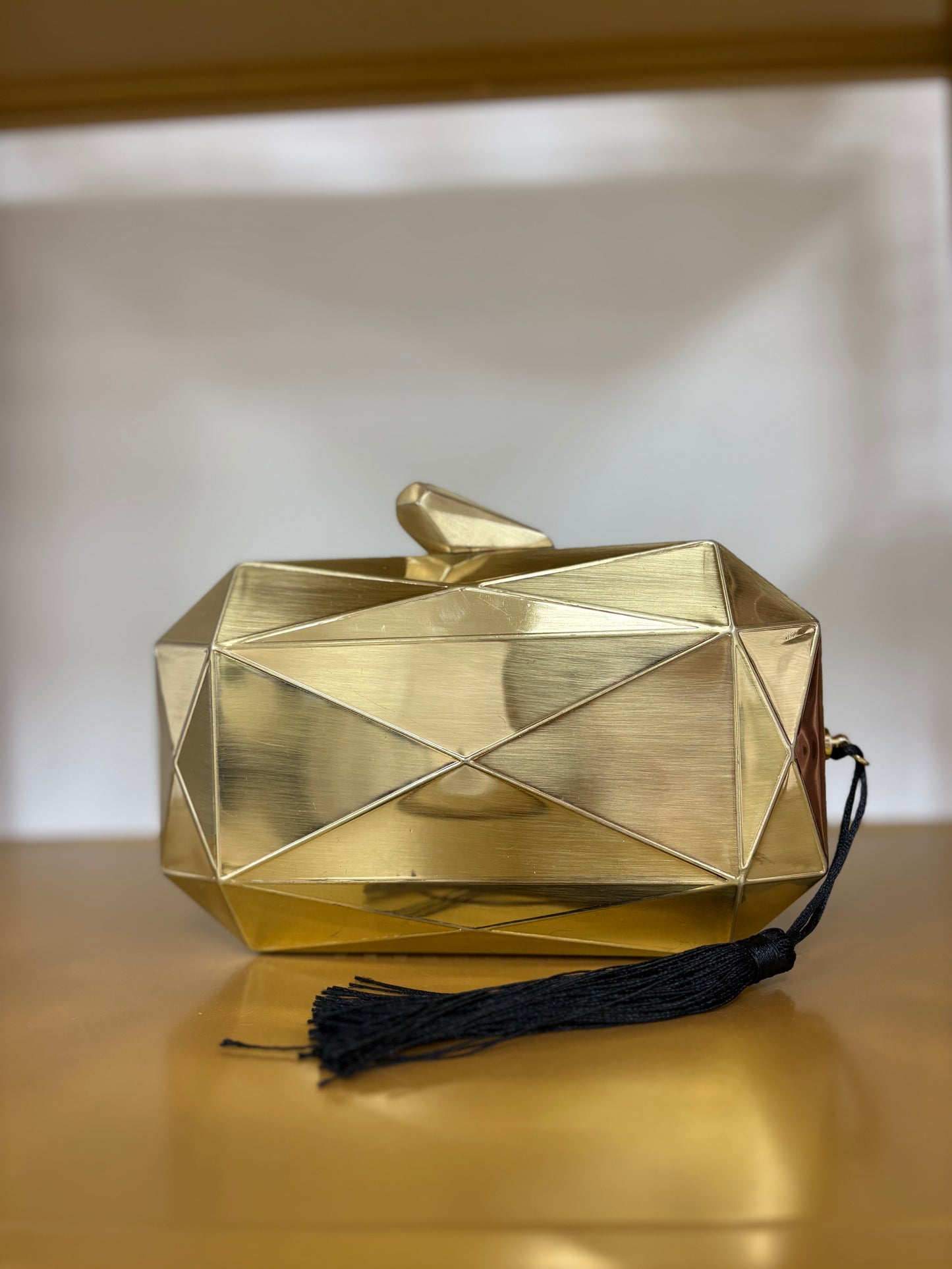 CARTERA METAL DORADA